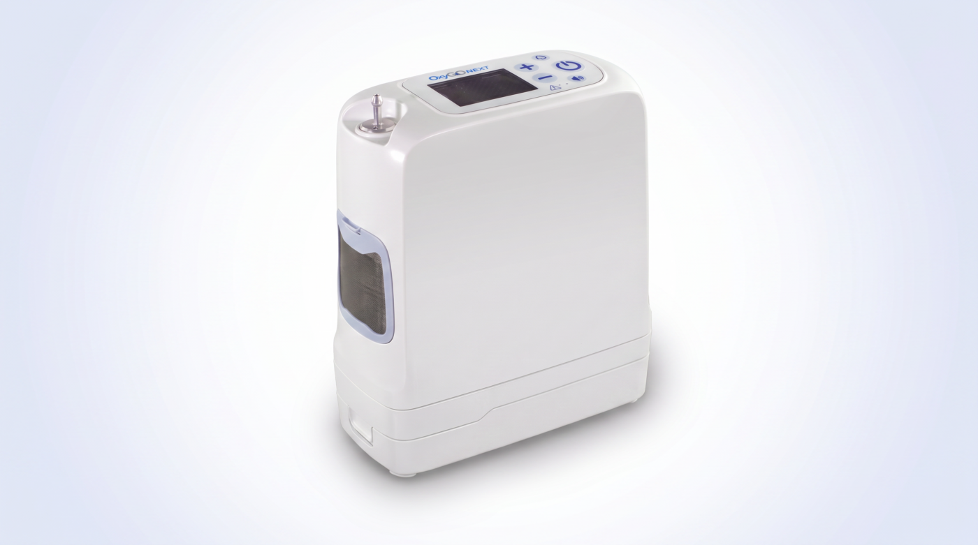 OxyGo NEXT portable oxygen concentrator with white and blue housing, front three-quarter view