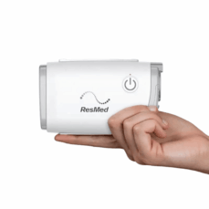 AirMini AutoSet held in one hand showing its palm-sized dimensions